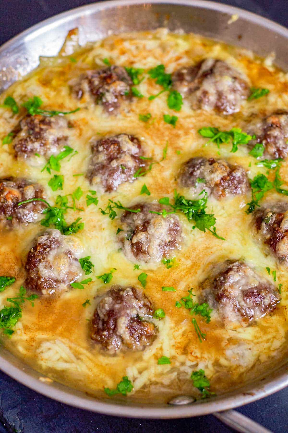French Onion Meatballs in a cheesy skillet.