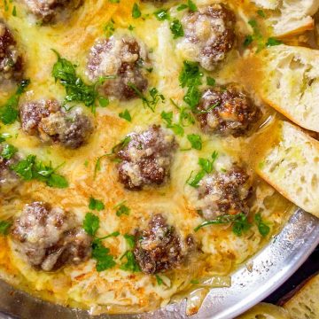 French Onion Meatballs with bread in a skillet.