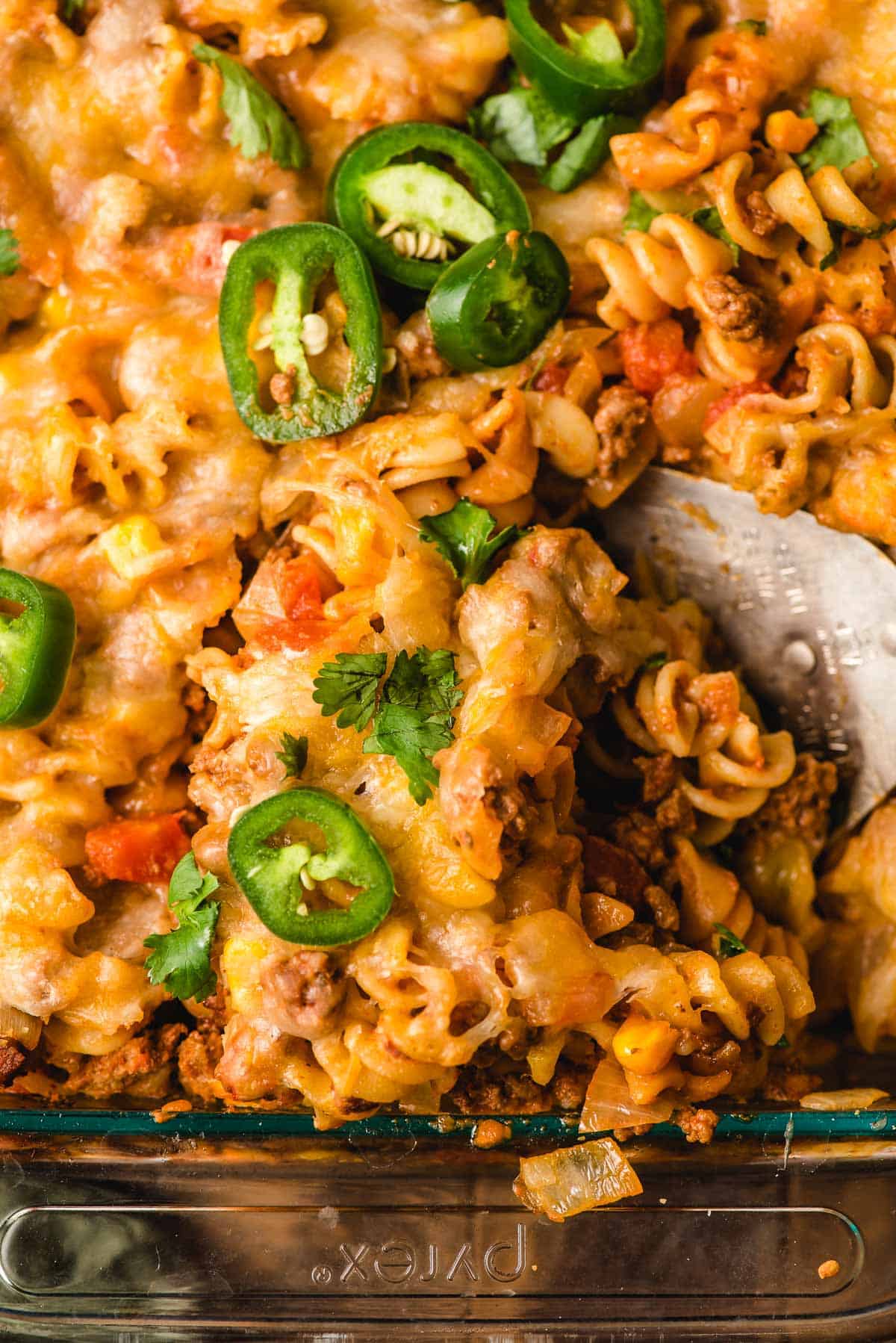 A scoop is taken out of a Taco Pasta Casserole.