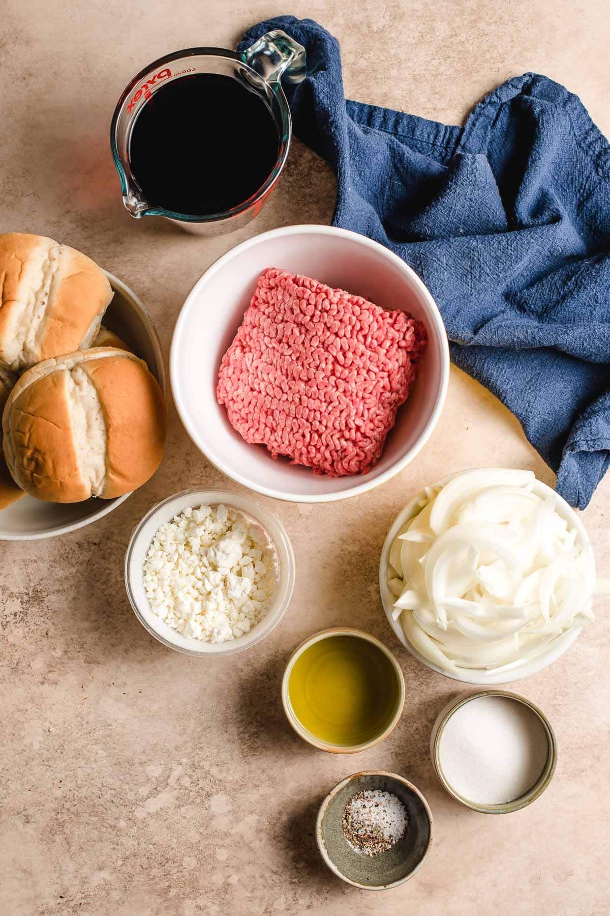 Ingredients for goat cheese burgers in bowls.