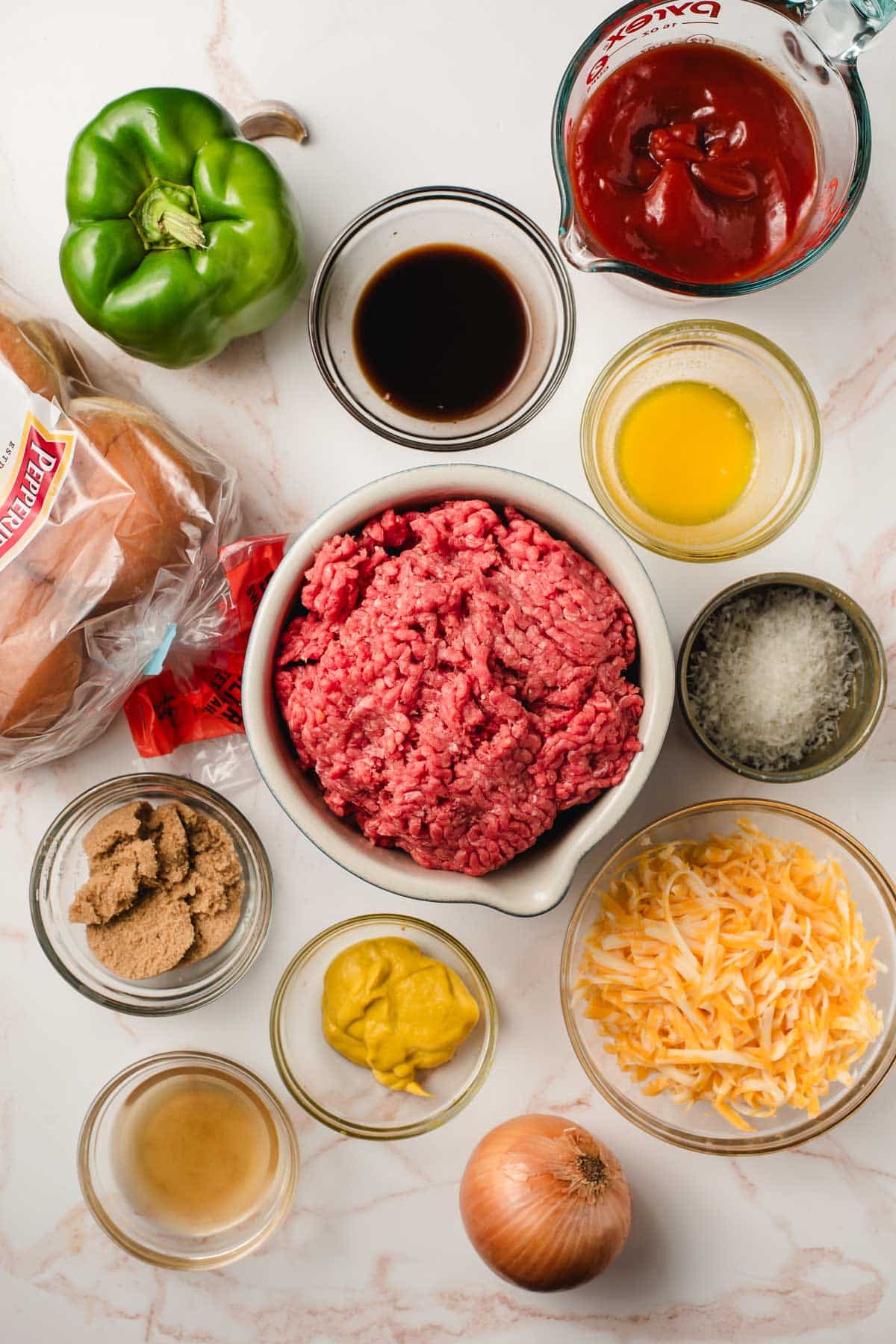 Ingredients for sloppy joe sliders set out on a table.