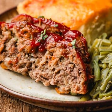Slices of Ritz cracker meatloaf on a plate.