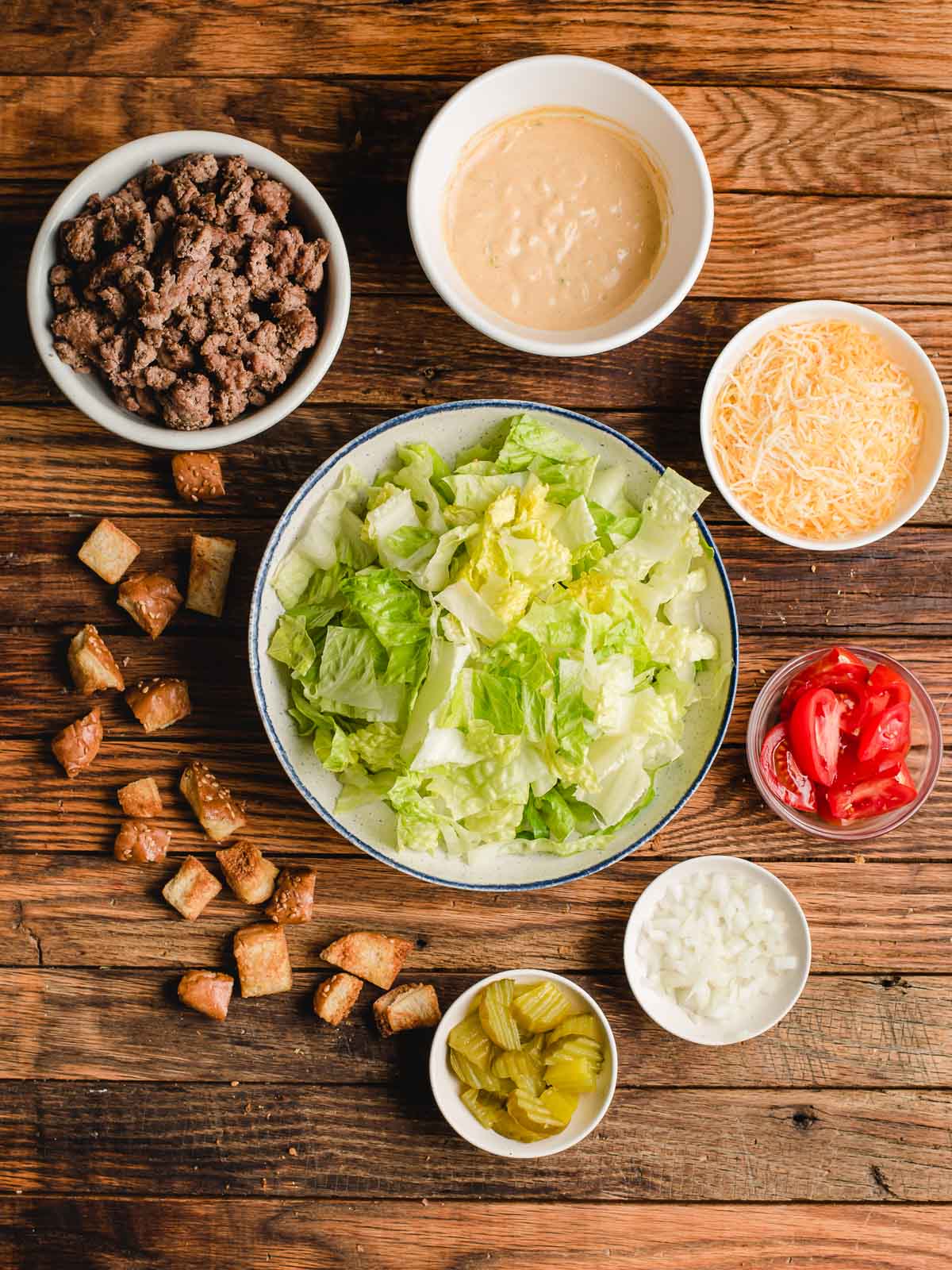 Ingredients laid out on a table to make Big Mac Salad.