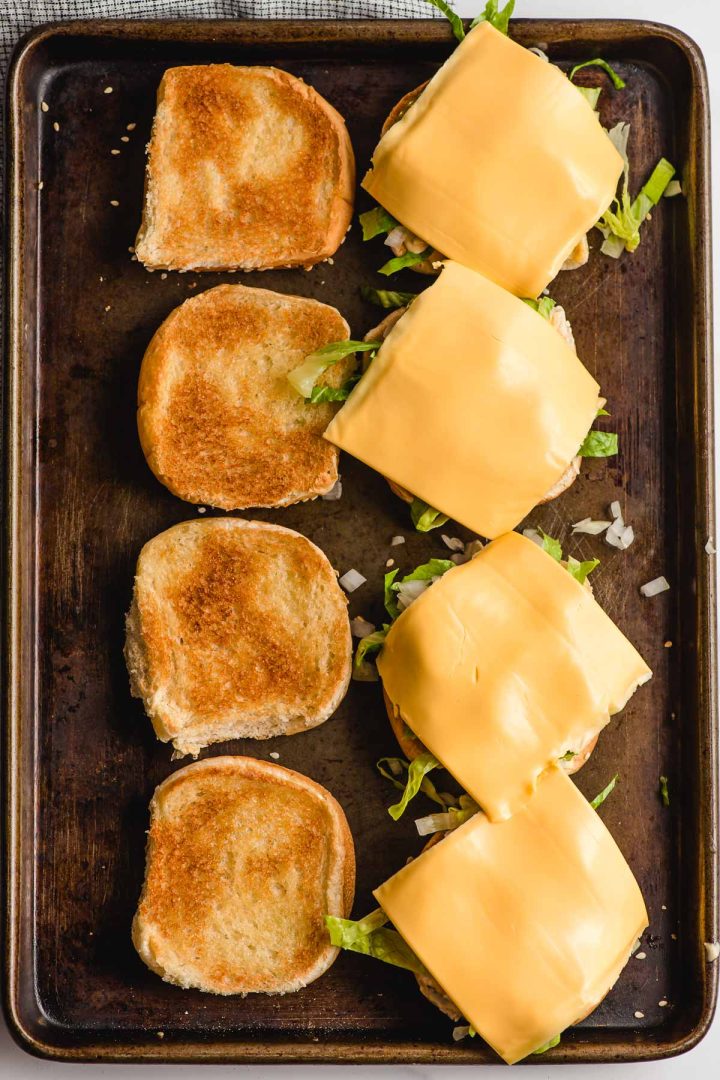 Toasted buns with lettuce and cheese.