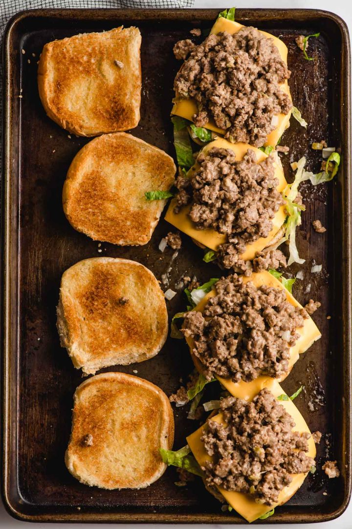 Toasted buns topped with lettuce, cheese, and big mac sloppy joe meat.
