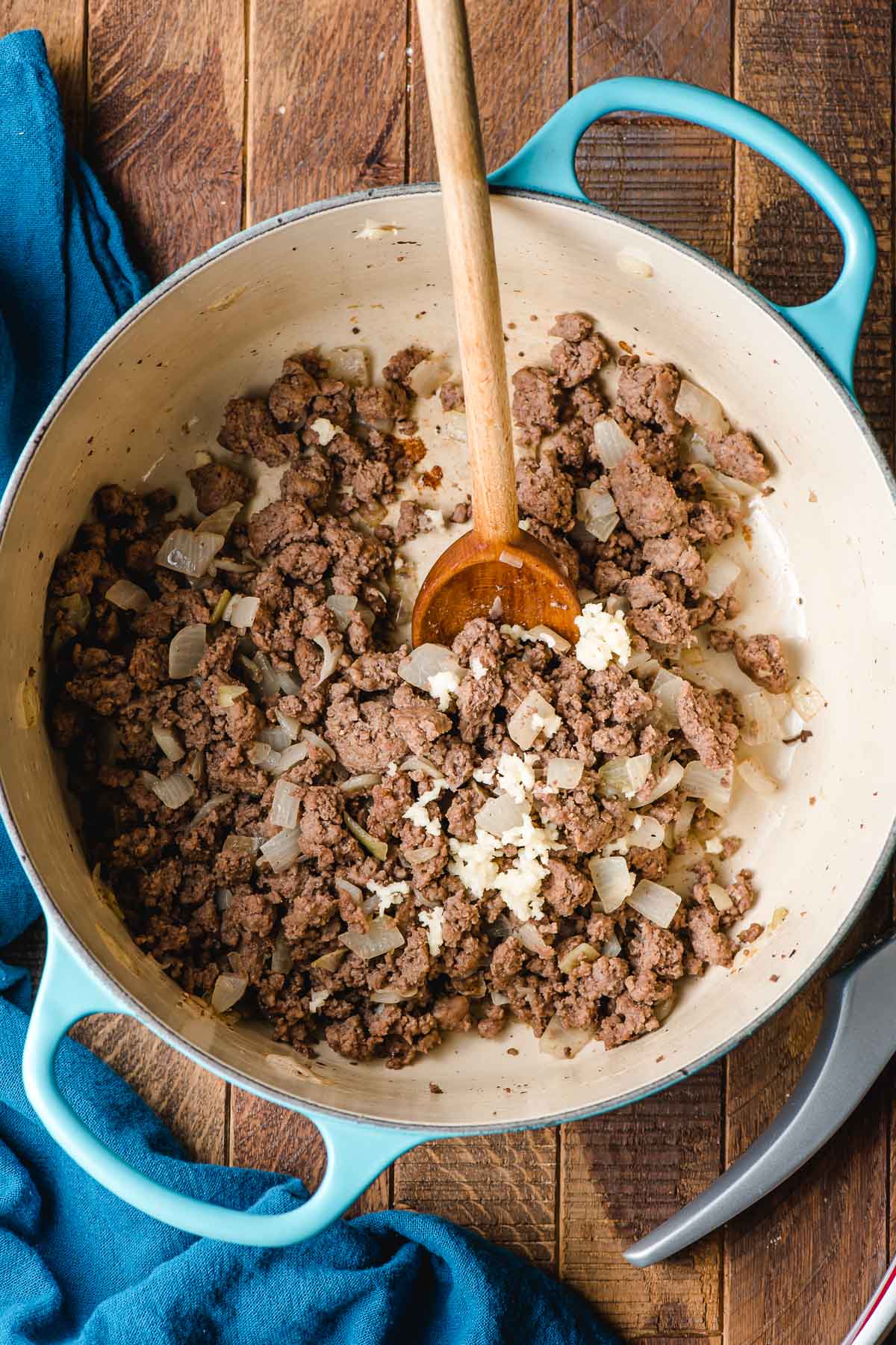 Beef sauteed with garlic and onions in a Dutch oven.