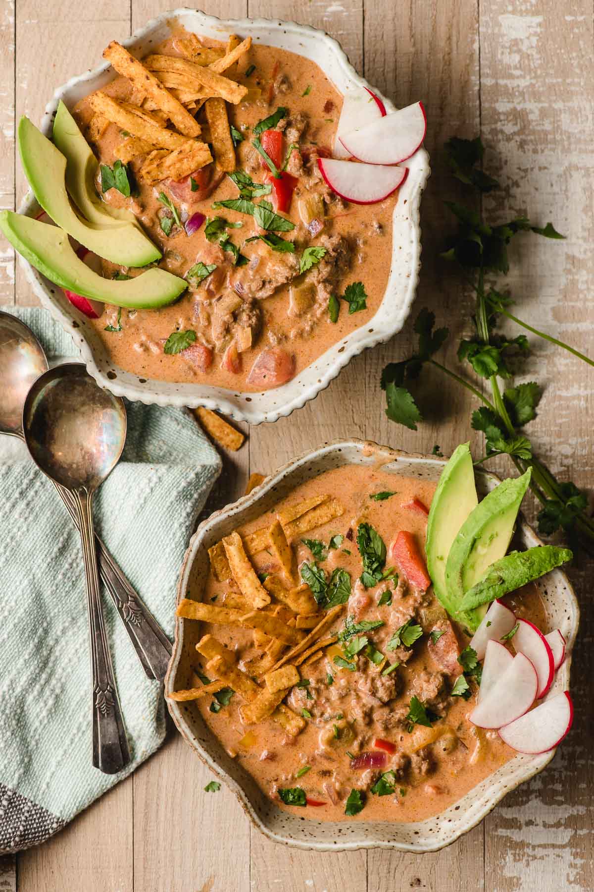 Two bowls of creamy taco soup on the table.