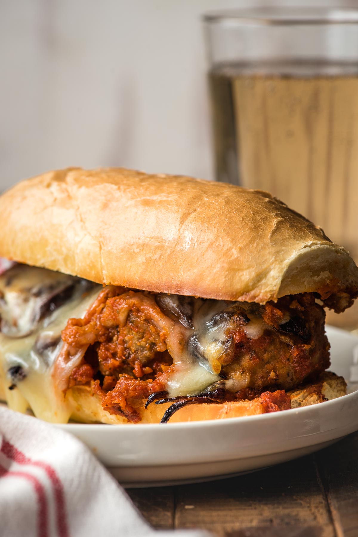 A melty meatball sub ready to eat.