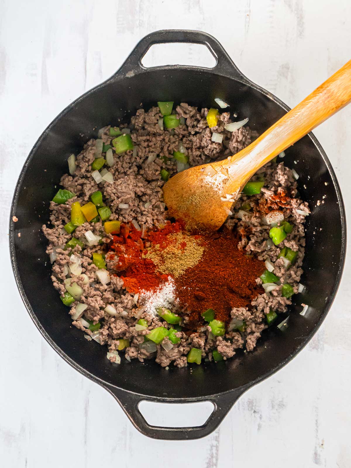 Sauteed ground beef and vegetables topped with ground cumin, chili, garlic powder, and salt.