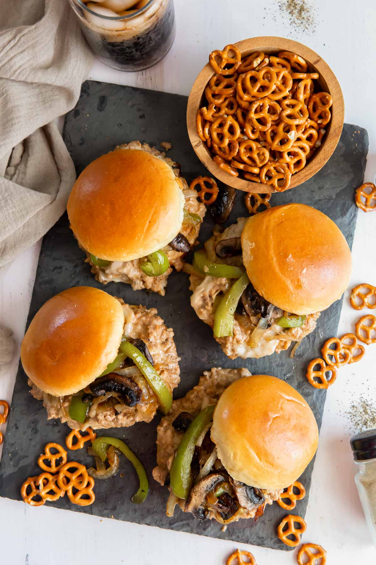 Four Philly Sloppy Joes served with pretzels.